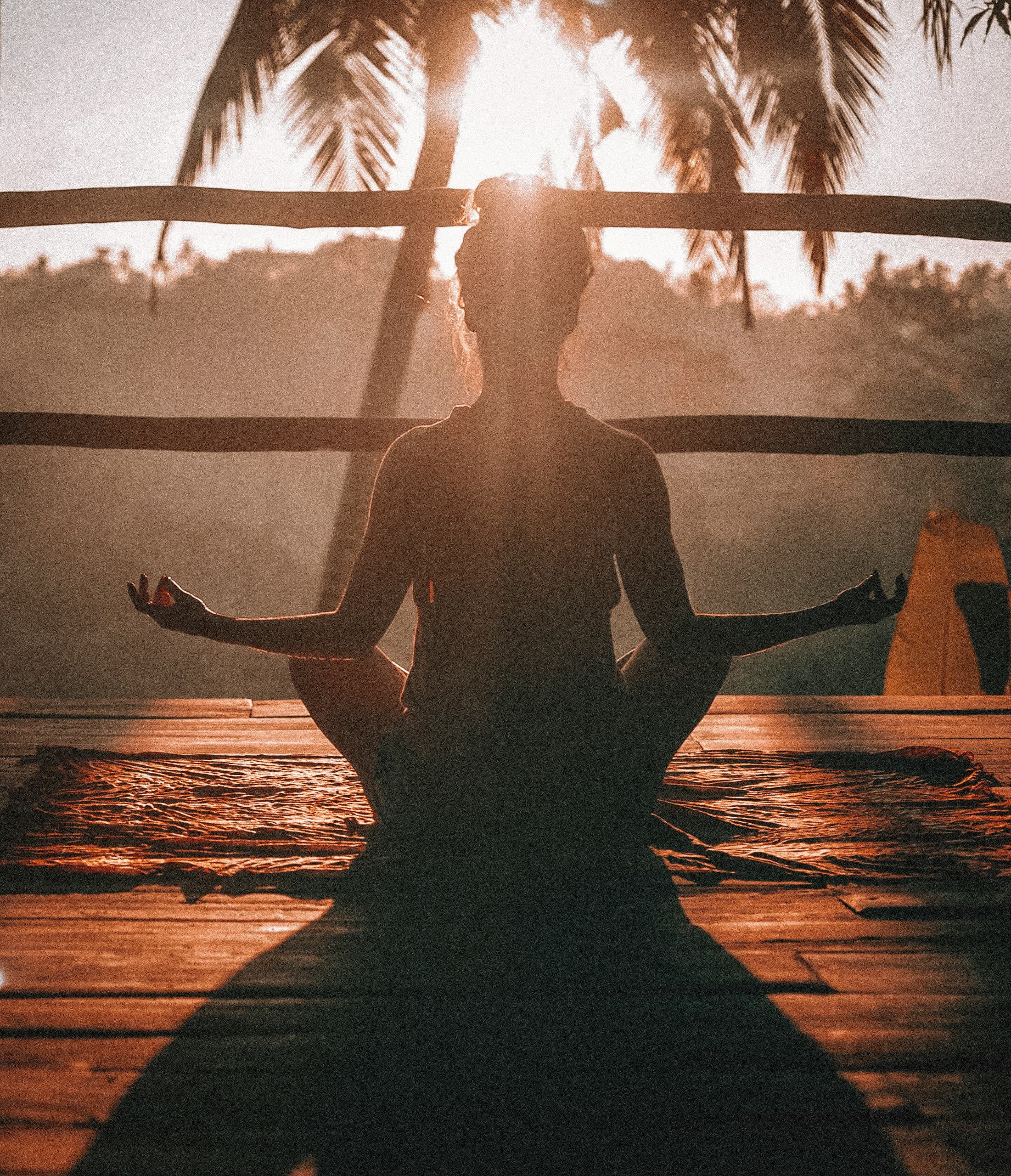 Person practicing mindful movement at sunrise